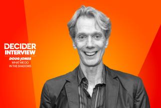 Doug Jones in black and white on a bright orange background